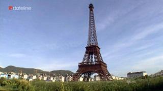 Is this landmark located in Paris, or somewhere else? The answer will surprise you.